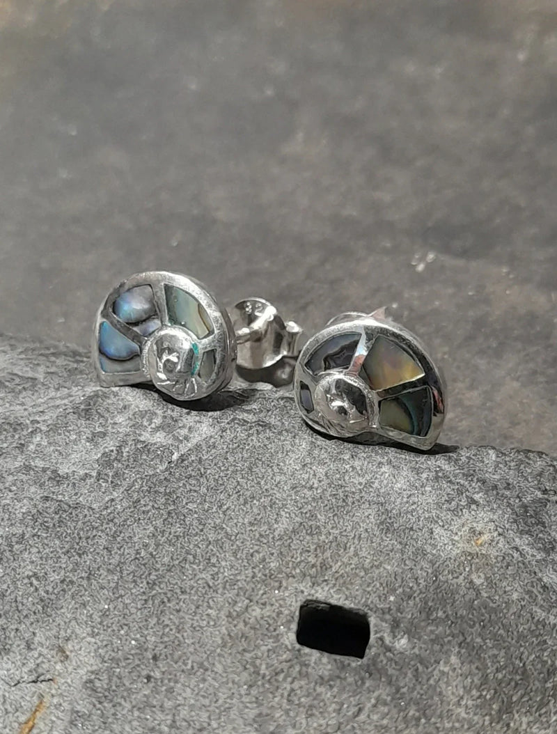Sterling silver stud earrings in the shape of a shell with inset abalone mother of pearl