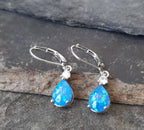 SE565B - 9MM TEARDROP S/PLATE BLUE SYN OPAL ER